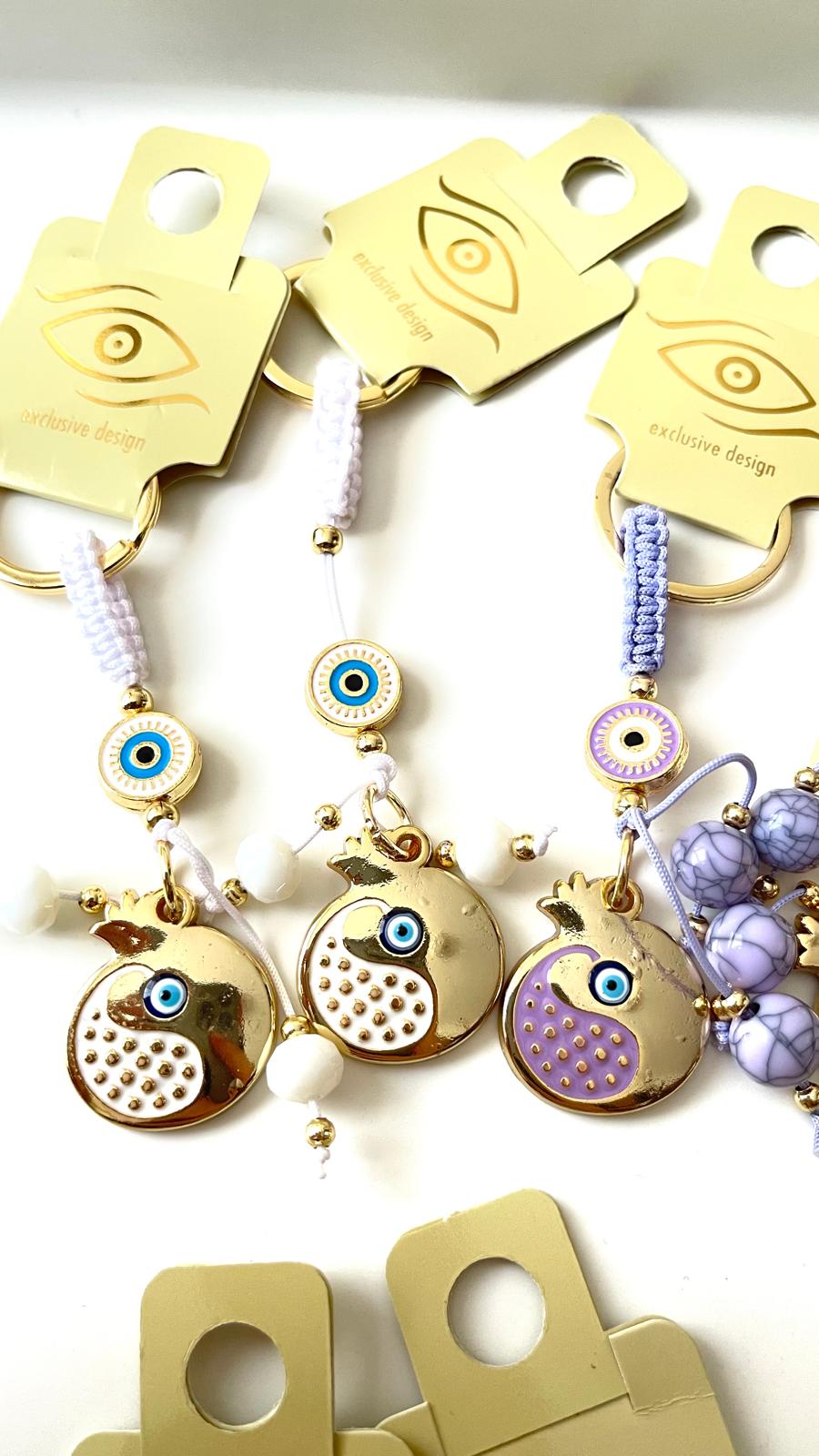Llavero con diseño de abundancia de granada blanca y ojo turco dorado