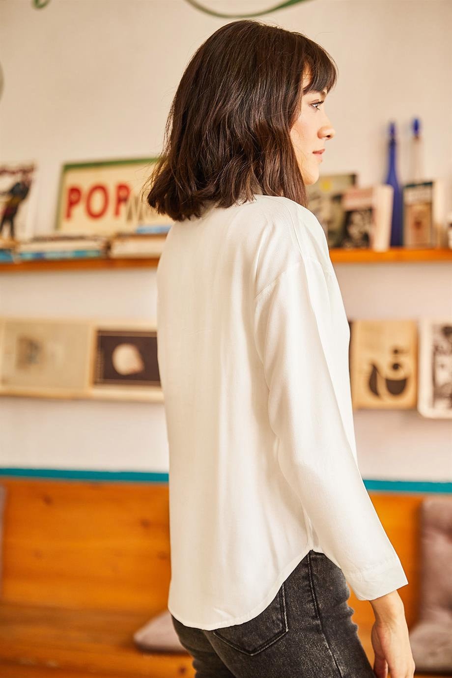 Zwarte blouse met knoopjes en een zakje