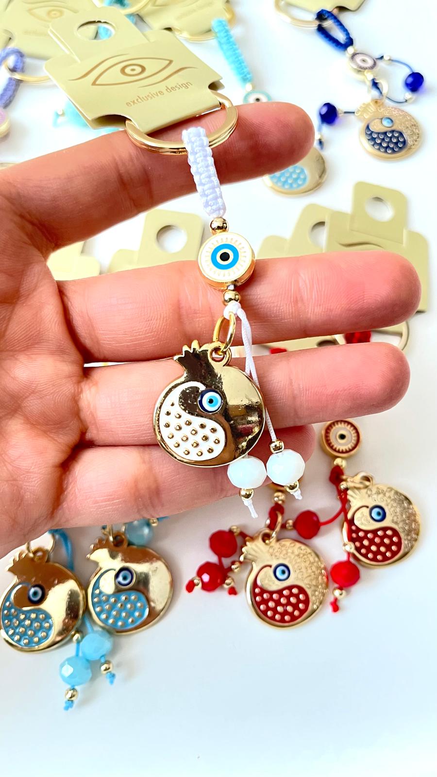 Llavero con diseño de abundancia de granada blanca y ojo turco dorado
