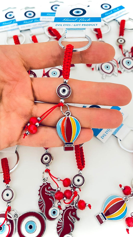Llavero de ojo turco plateado con diseño de globo rojo