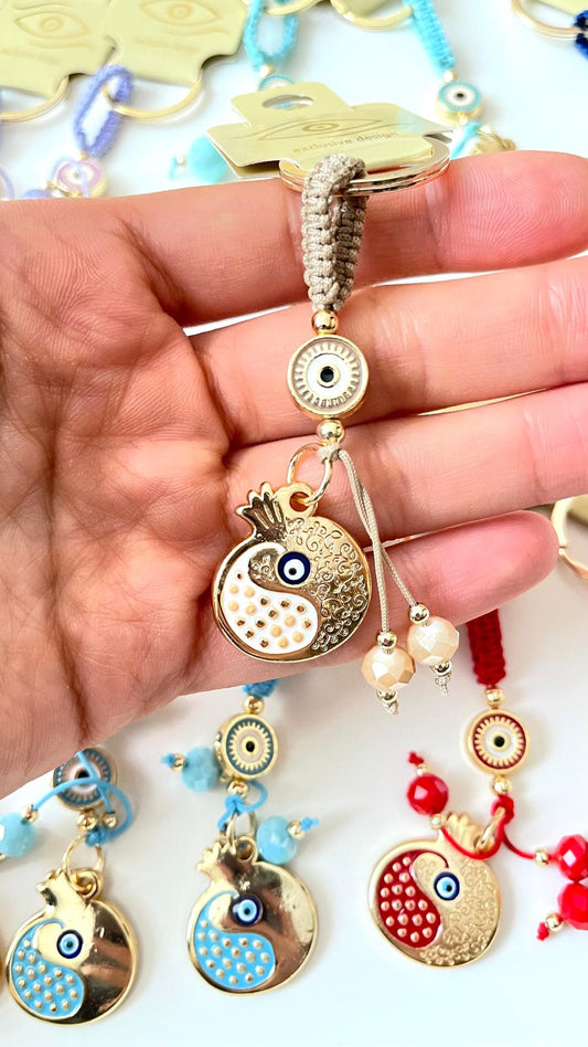 Llavero de ojo turco dorado con diseño de abundancia de granadas beige