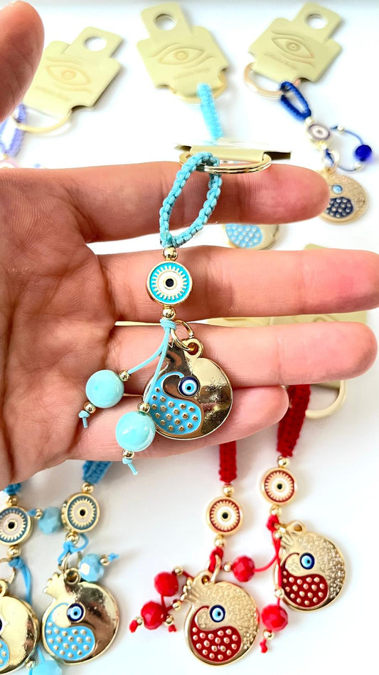 Llavero de ojo turco dorado con diseño de abundancia de granada turquesa